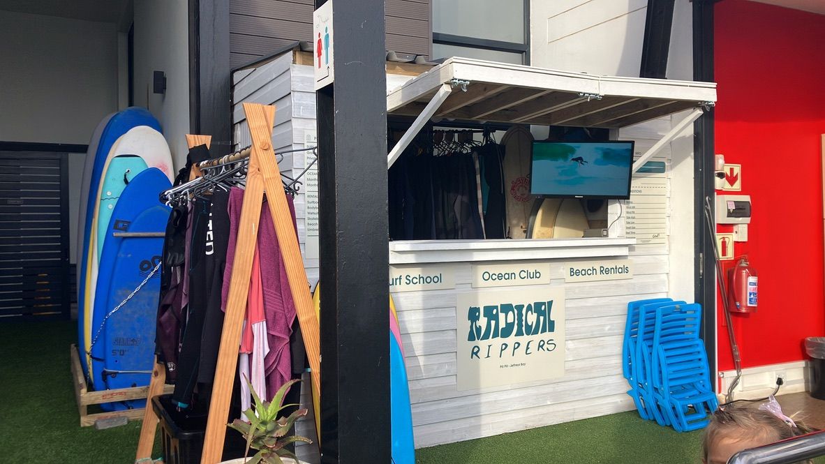 Radical Rippers kiosk signage at Pili Pili Beach