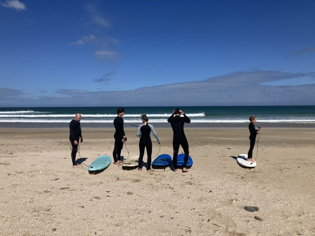 Radical Rippers surf lesson group getting ready at Pili Pili Beach